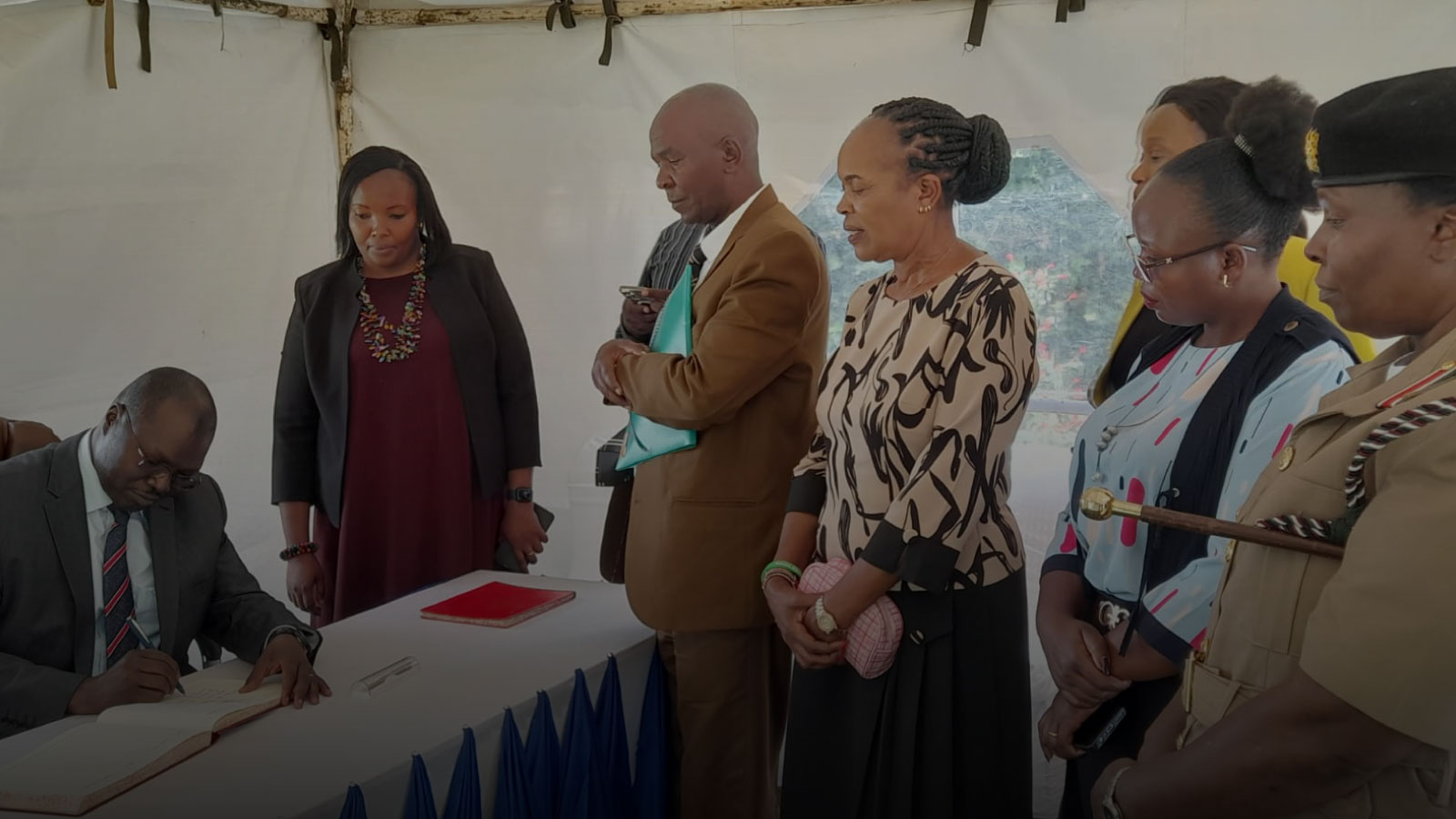 Signing-of-visitors-book-by-Hon-Simon-K.-Chelugui,-EGH Signing of visitors book by Hon Simon K. Chelugui, EGH.